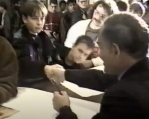 the author aged 13 shaking hands with actor John Saxon